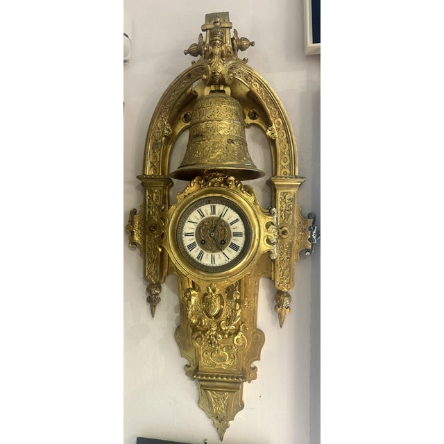 Large and impressive wall clock with bell at top. French 19th century. Enameled dial with roman numerals and central...