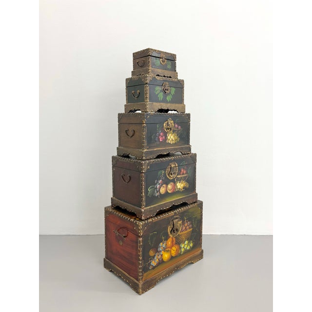 A phenomenal set of five vintage hand-painted nesting storage boxes featuring richly detailed still life fruit motifs...