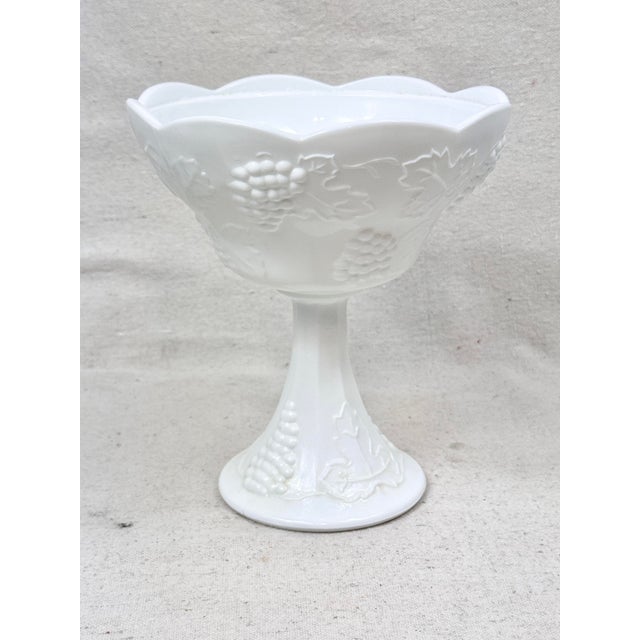 Vintage milk glass scalloped footed bowl/compote. Features a grape vine design. Perfect to use with candies or fruits. But...
