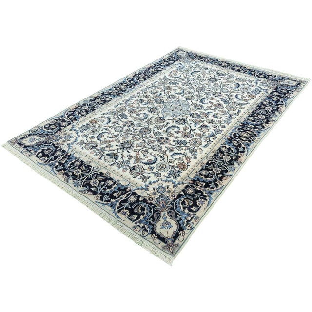 This hand-knotted Kashmar cork rug impresses with its exceptionally fine craftsmanship and elegant, all-over floral...