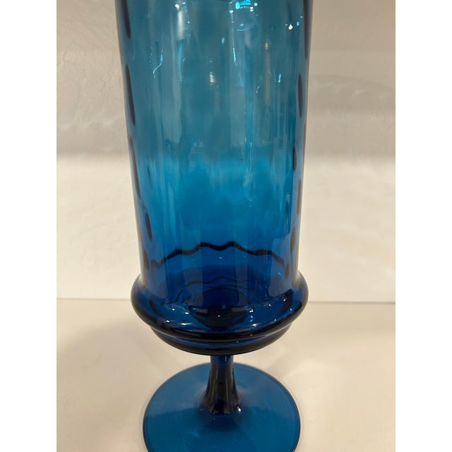 This vase was hand made in Empoli, Italy during the mid century period, it’s a gorgeous teal blue optic glass and one of...