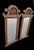 A wonderful pair of extra tall curvy pagoda style wall mirrors. The mirrors are in their original faux wood finish. The...