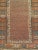 A charming late 19th century Kurdish area rug hand knotted in an allover design based on a variation on the paisley...