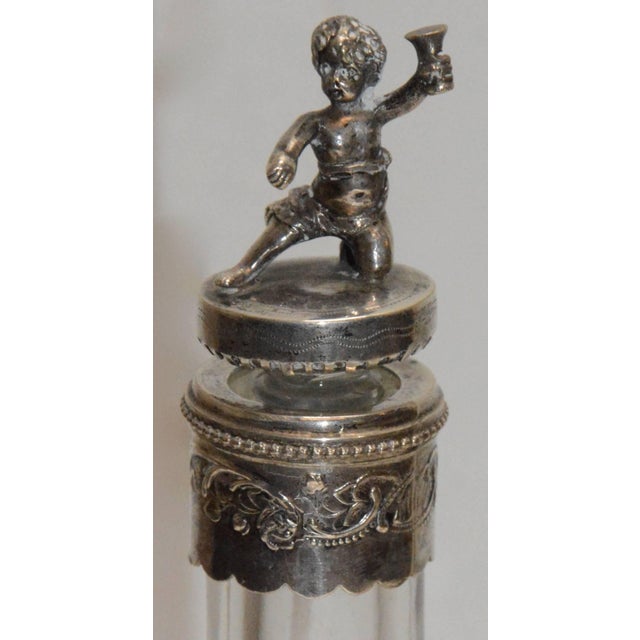 Featured is a beautiful decanter and six cordial cups made up of engraved crystal and sterling silver. The decanter is...