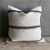 Creamy white hemp rug pillow with stripes. Soft hand, linen blend backing with zipper closure. Spot cleaning is...