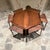 AMBIANIC presents: Set of 6 rosewood nesting tables tucked underneath hexagonal coffee table. Made Denmark 1950s Set...