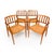 A stunning set of four Danish Modern dining chairs designed by J.L. Møller, featuring two Model 83 armchairs and two Model...