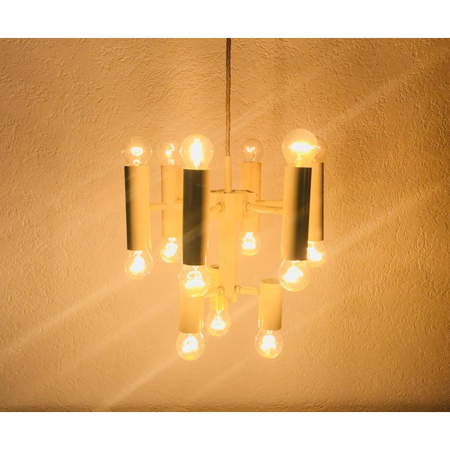 An extraordinary Sciolari chandelier made in Germany in the 1960s. It is fascinating with its 9 amazing arms. The two-tier...