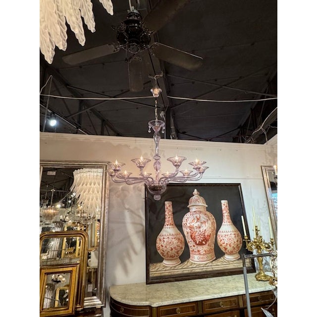 This modern chandelier features a large size and is crafted from beautiful lavender colored blown Murano glass. It boasts...