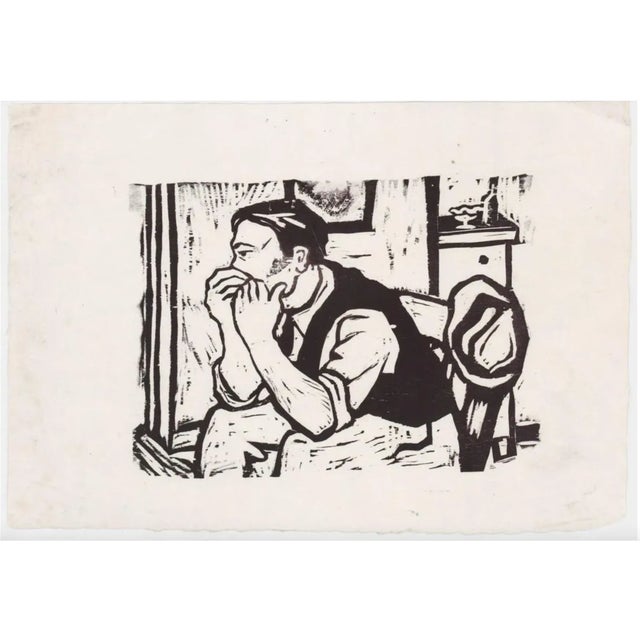 1960s unsigned woodblock print of a man in a chair.