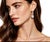 Add elegance with this gorgeous pair of 18K white gold earrings, featuring a sunflower design adorned with brilliant round...