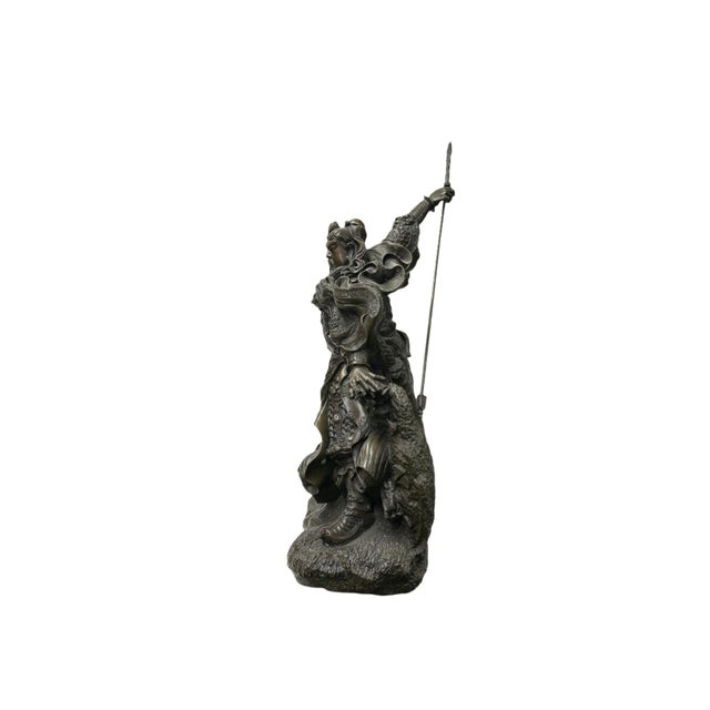 This is a detailed, dynamic bronze statue depicting Guan Yu (also known as Guan Gong), the famous general from the Three...