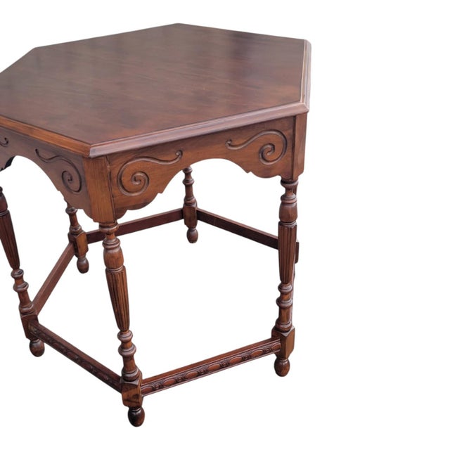 Vintage 1940s American center table crafted from beautiful cherry wood. Features a carved decorative apron and turned...