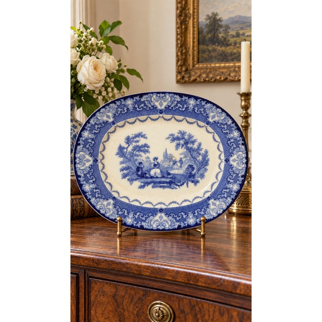 A substantial late-19th-century English flow-blue transferware platter by Doulton of Burslem in the romantic Watteau...