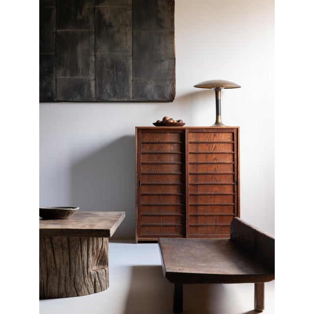 A beautifully balanced Japanese antique storage cabinet crafted in Japan during the Taishō to early Shōwa period. Made...