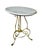 A fabulous vintage side table featuring a honed Carrara marble top supported by mahogany and resting atop a solid wrought-...