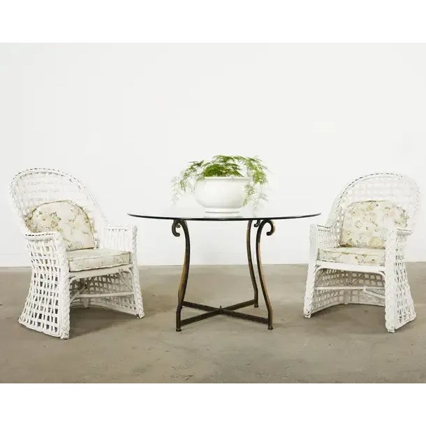 Mid-century modern set of six rattan garden dining armchairs made in the California coastal organic modern style featuring...