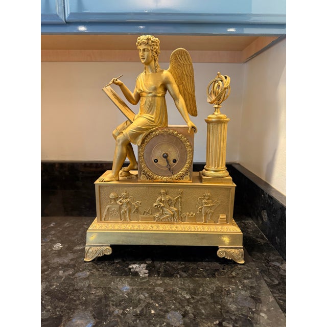 An exceptional early 19th-century French gilt and chased bronze mantel clock depicting an Allegory of Astronomy and the...