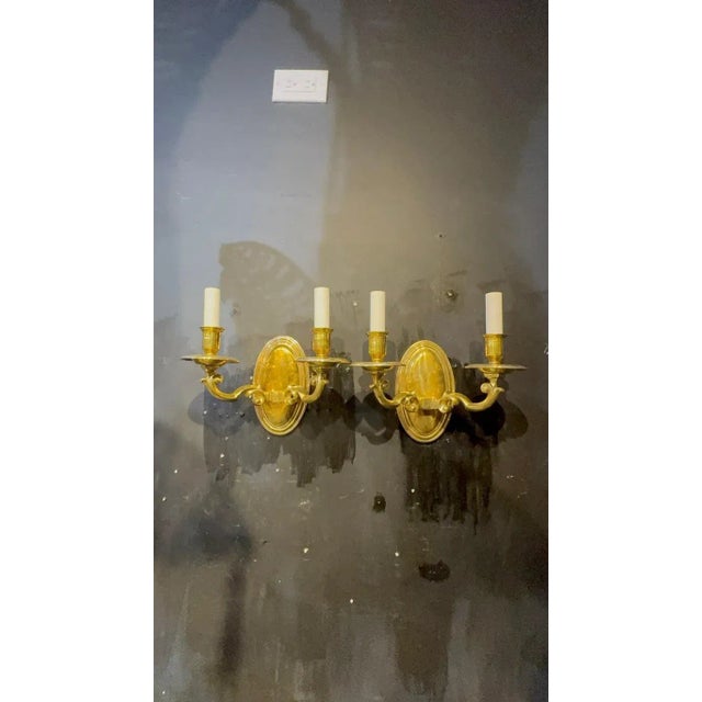 Pair of circa 1920’s Caldwell gilt bronze colonial style sconces double lights