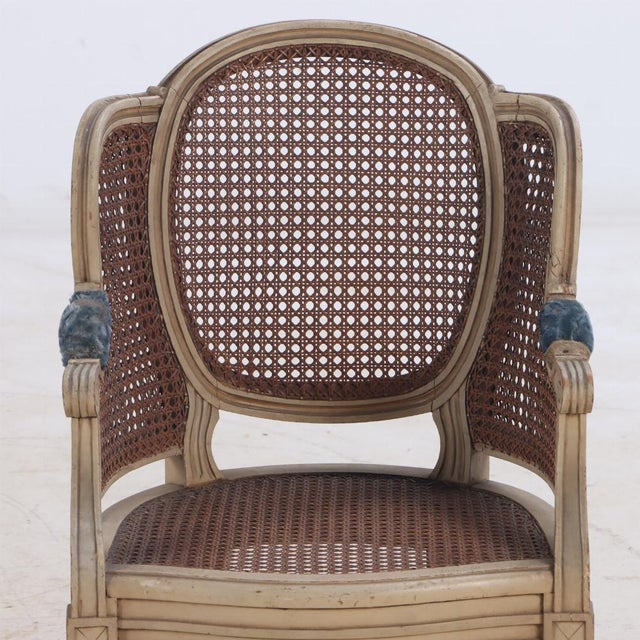 French Louis XVI style child's size painted Bergere chair, C 1930, with cane seat and back. A great gift for your...