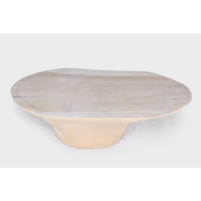 This oval coffee table is hand carved out one single block of wood. The top and sides are hand cut, sand, and finished in...