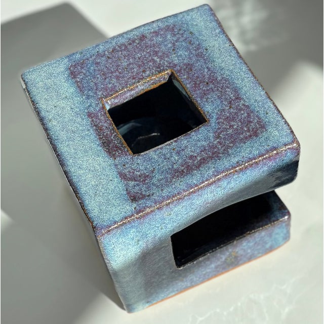 This Blue Artisan Ceramic Sculpture "Ball Cubed"is in New condition.. Measures 5 1/2 x 5 1/2" and weighs 6 pounds. Signed...