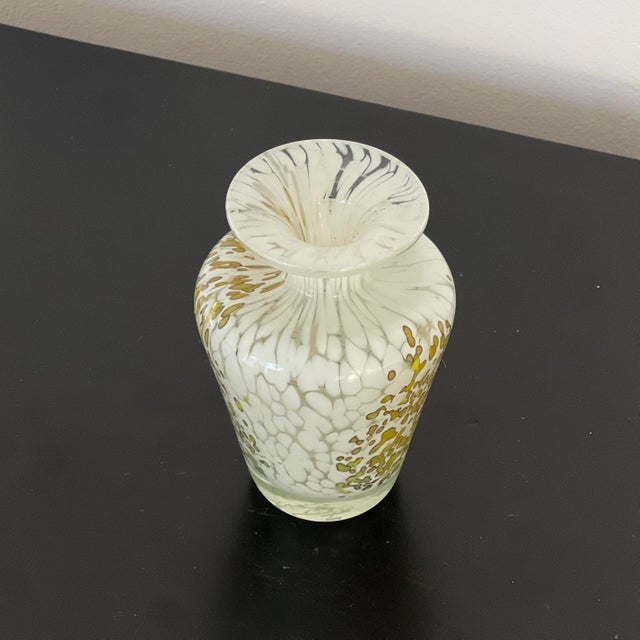 A rare and highly collectable bud vase by Mdina glassware, established in 1968 in Malta by Michael Harris, a lecturer in...