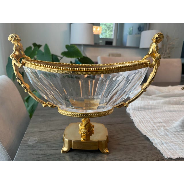 A luxurious signed French Empire-style centerpiece bowl by Martin Benito, featuring brilliant hand-cut crystal mounted in...