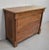 Refined Bicentennial Chest of Drawers in Solid Walnut. Its Tabbed Top tops a Projection Belt opening on a Drawer, narrower...