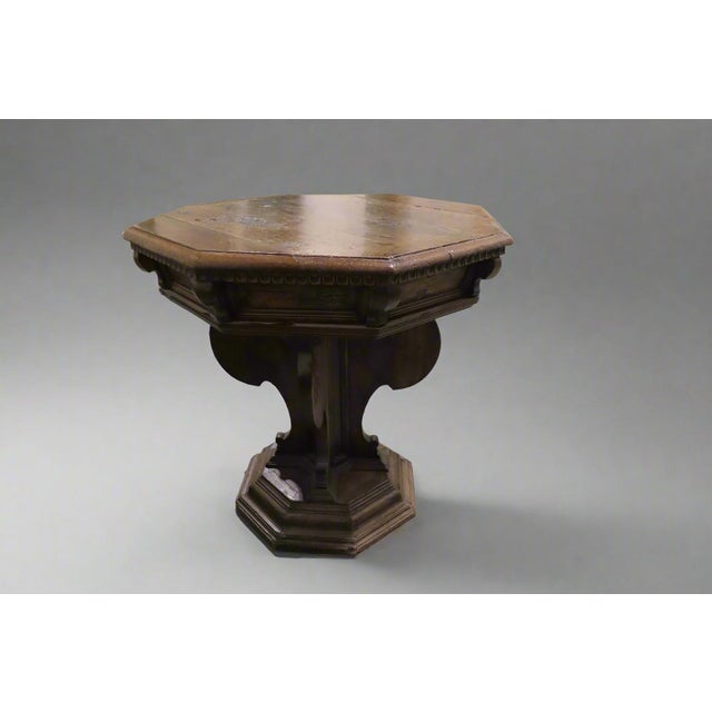 Gorgeous octagonal side table made with a burl wood top and a dark wood spoked base. This table is crafted in an old...