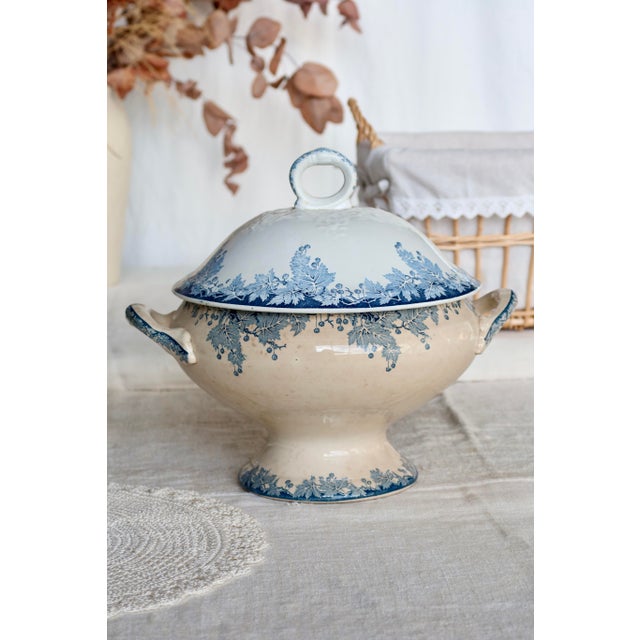 Antique ironstone tureen from the Saint Amand Hamage Nord pottery, Platane pattern, with a blue floral design on an ivory...