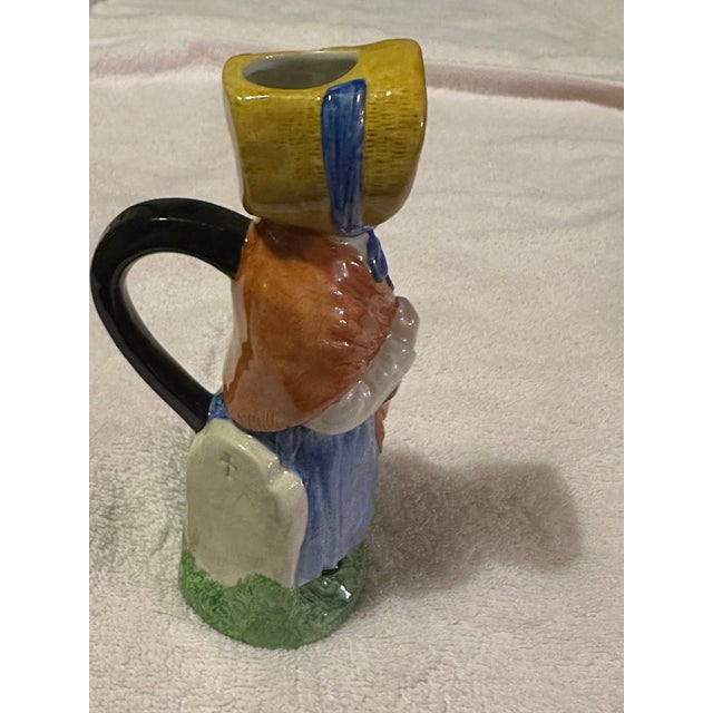 This is one Toby Jug named Little Nell from a set of 12 art pottery jugs from the novels of Charles Dickens. It is 6" tall...