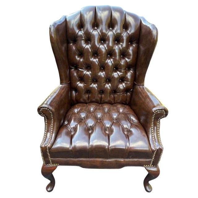 Queen Anne Style Tufted Leather Look Wingback Chair This tufted chesterfield style wingback chair is sure to be a stately...