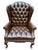 Queen Anne Style Tufted Leather Look Wingback Chair This tufted chesterfield style wingback chair is sure to be a stately...