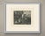 An elderly tinker sits on the ground at the edge of a wood, absorbed in his work. Bent forward in a white shirt with...