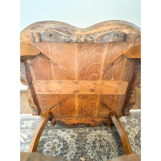 Beautiful antique solid quarter-sawn oak lamp table featuring a softly scalloped top, carved foliate apron, graceful...