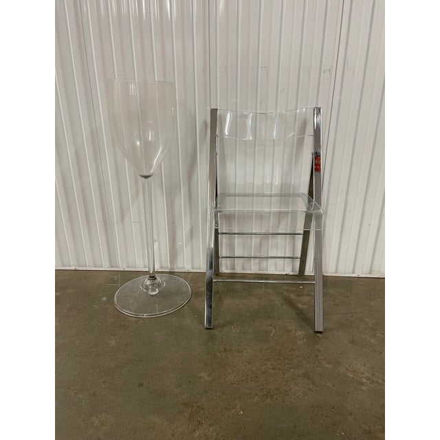 1 folding ghost chair (we have 8 listed for sale) When your table or the food laid on it is the masterpiece pair it with...