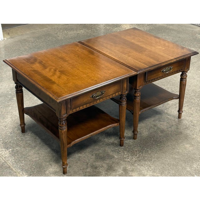 Beautiful pair of end tables by Ethan Allen from the “Classic Manor” collection. Features solid maple construction, turned...