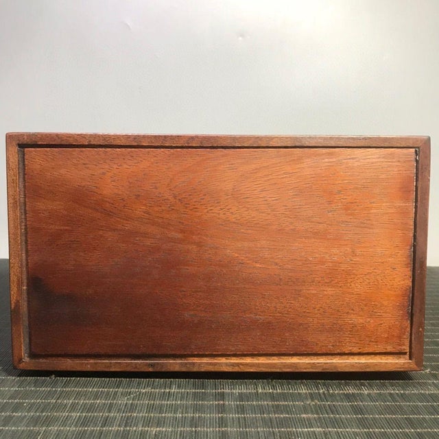 This impressive vintage Chinese box is a striking example of traditional craftsmanship. Crafted from dense, richly grained...