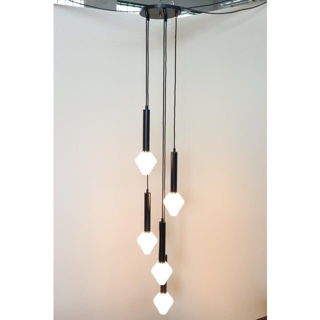 This exquisite chandelier showcases a distinctive cascade design, crafted in Italy during the 1960s or 1970s. Its elegant...