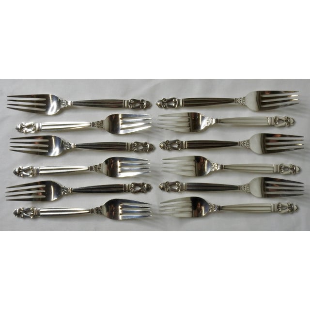 We are offering a Georg Jensen Acorn sterling silver flatware consisting of service for 12 with a total of 72 pieces. The...