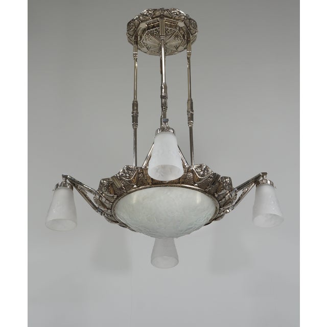 H. Petitot & Muller frères A large French 1930-35 art deco chandelier in nickel plated bronze by the famous Paris based...