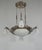 H. Petitot & Muller frères A large French 1930-35 art deco chandelier in nickel plated bronze by the famous Paris based...