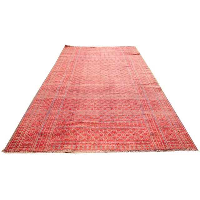The Antique Textile Rug is a mid-20th-century Persian formal piece featuring a prominent blue ground, cotton material, and...