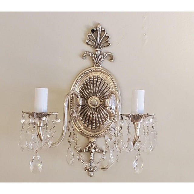 Pair of 2 lights, Silver sconces with crystal prisms. They are in mint condition.