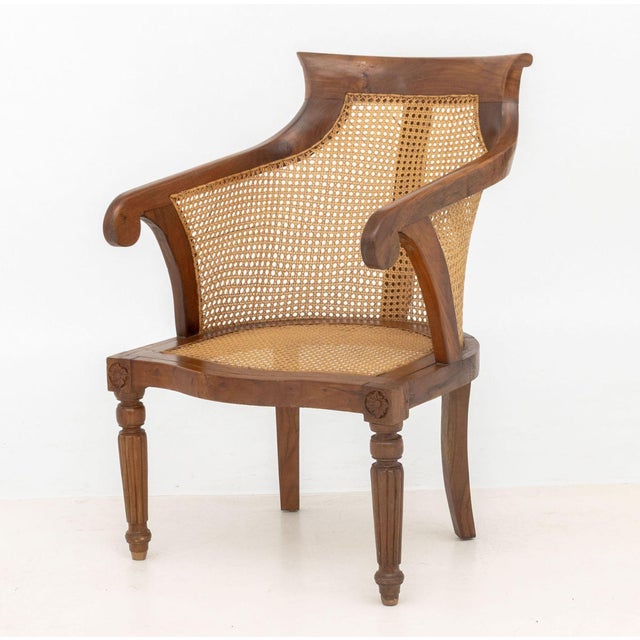 French Empire Style Cane Paneled Walnut Bergere, with leopard print upholstered cushion. 35.25" H x 22.25" W x 25.75" D;...