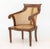French Empire Style Cane Paneled Walnut Bergere, with leopard print upholstered cushion. 35.25" H x 22.25" W x 25.75" D;...