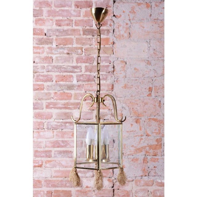This elegant chandelier represents a refined blend of the modern Art Deco style and the traditional Gustavian style,...