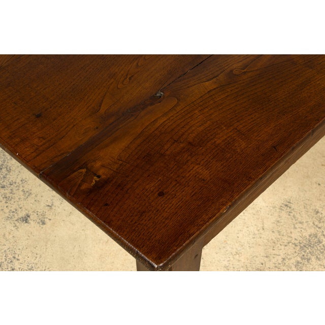 Handsome mid-19th century French Louis Philippe table in solid oak, sourced in Provence, France. The table features a...