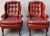 A distinguished pair of Classic Leather Furniture wingback library lounge chairs, expertly handcrafted in the United...